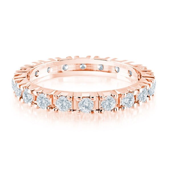 Rose gold wedding band with diamond accents on a white background.