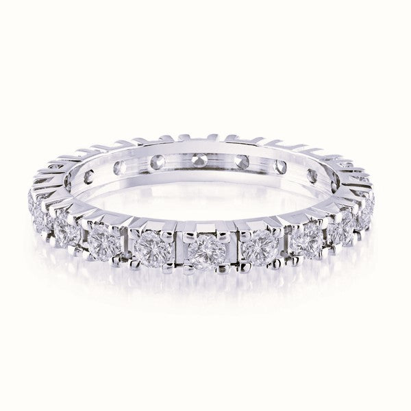 White gold wedding band with diamond accents on a white background.