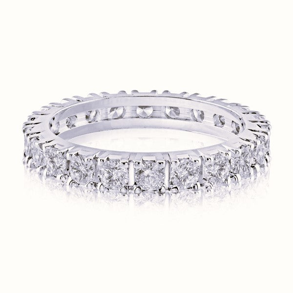 White gold wedding band with diamond accents on a white background.