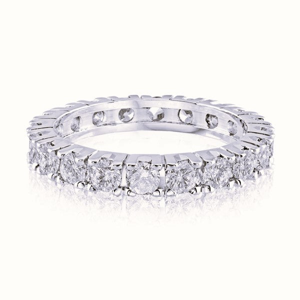 White gold wedding band with diamond accents on a white background.