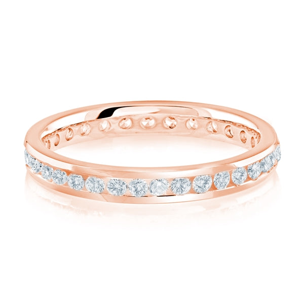 Rose gold wedding band with diamond accent on a white background.