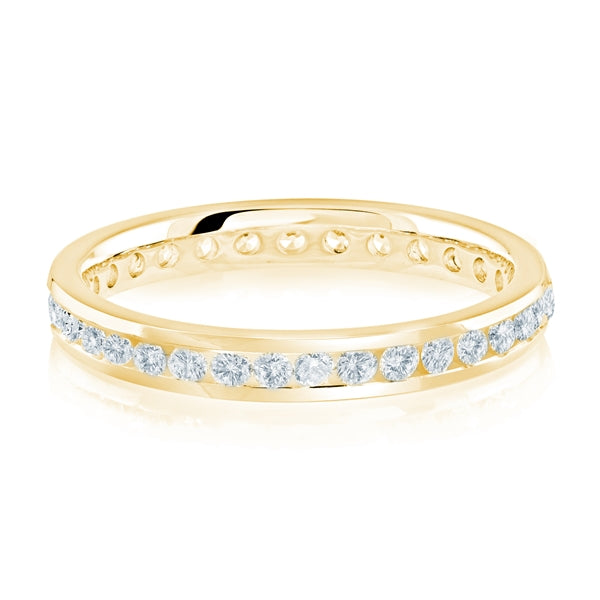 Gold wedding band with diamond accent on a white background.