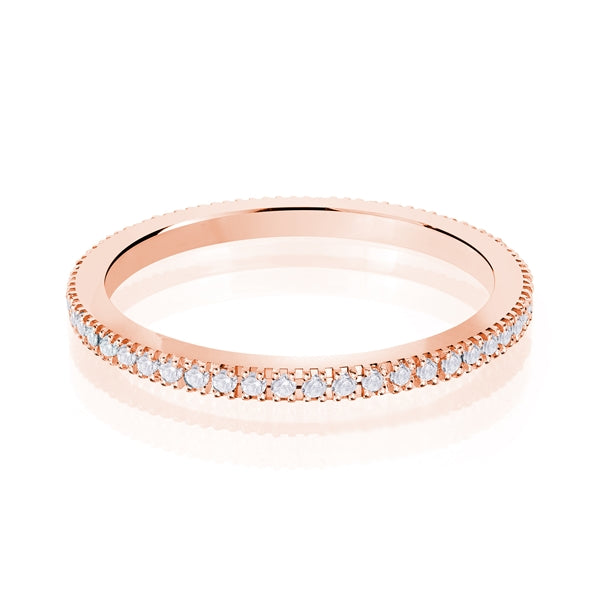 Rose gold wedding band with diamond accent on a white background.