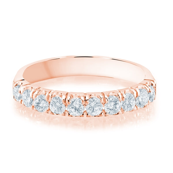 Rose gold wedding band with diamond accents on a white background.