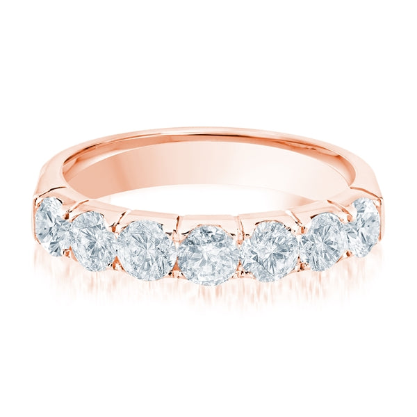 Rose gold wedding band with diamond accents on a white background.