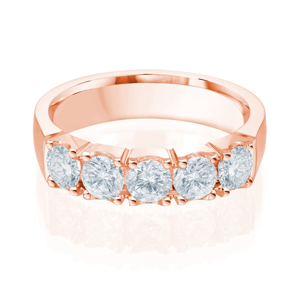 Rose gold wedding band with diamond accents on a white background.