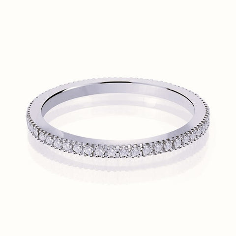 White gold wedding band with diamond accents on a white background.