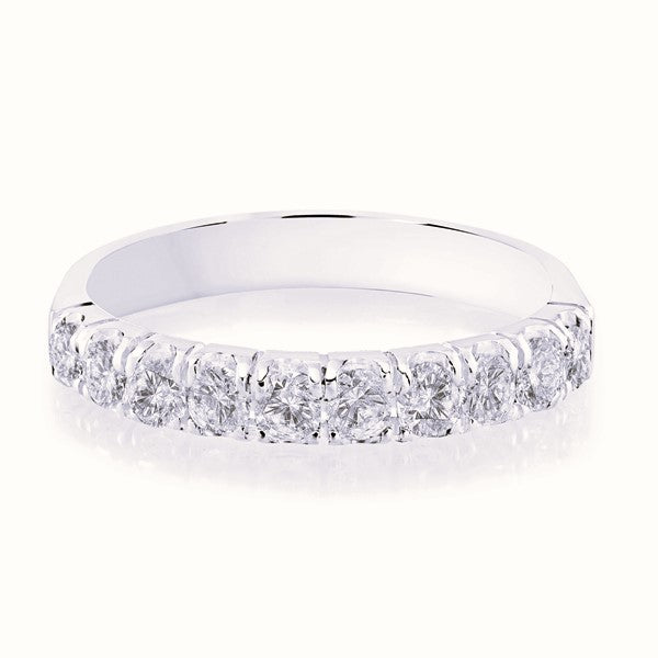 White gold wedding band with diamond accents on a white background.