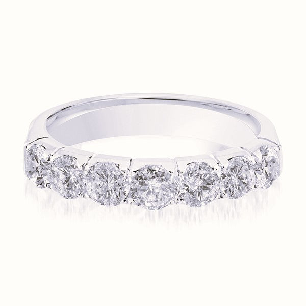 White gold wedding band with diamond accents on a white background.