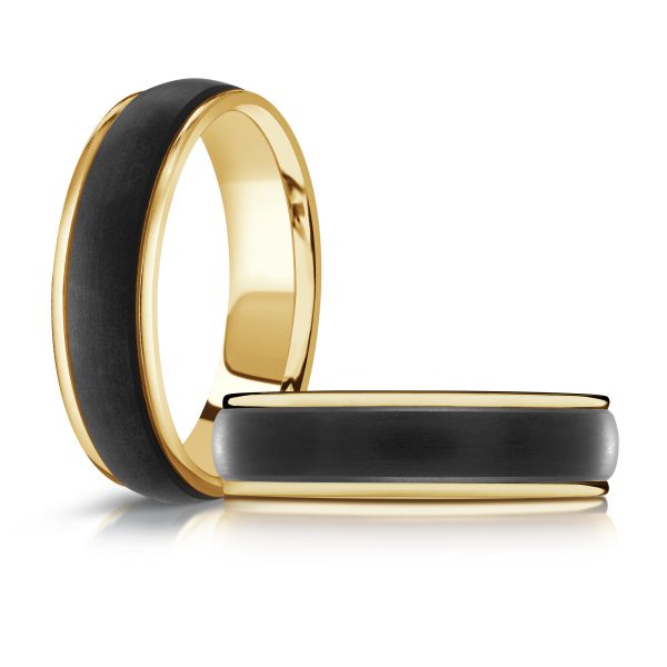 Yellow gold black ceramic wedding band, on a white background.