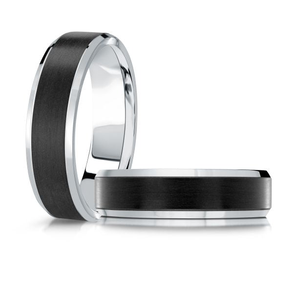 White gold black ceramic wedding band ring on a white background.