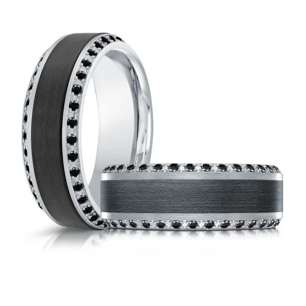 Black ceramic wedding band with a silver inlay and black diamonds on a white background.