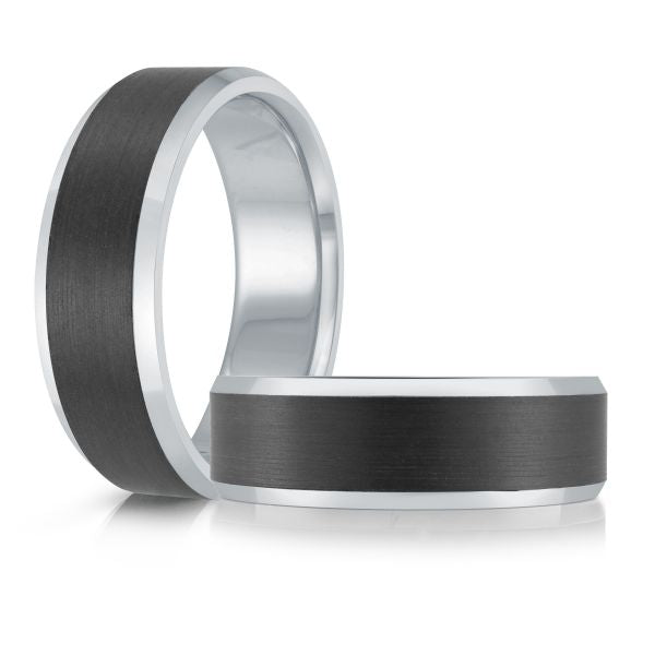 White gold black ceramic wedding band ring on a white background.