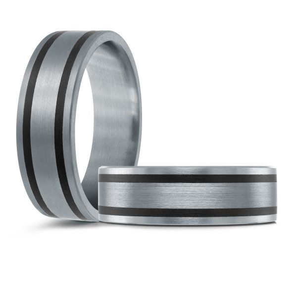 Grey metal wedding band with black stripes on a white background