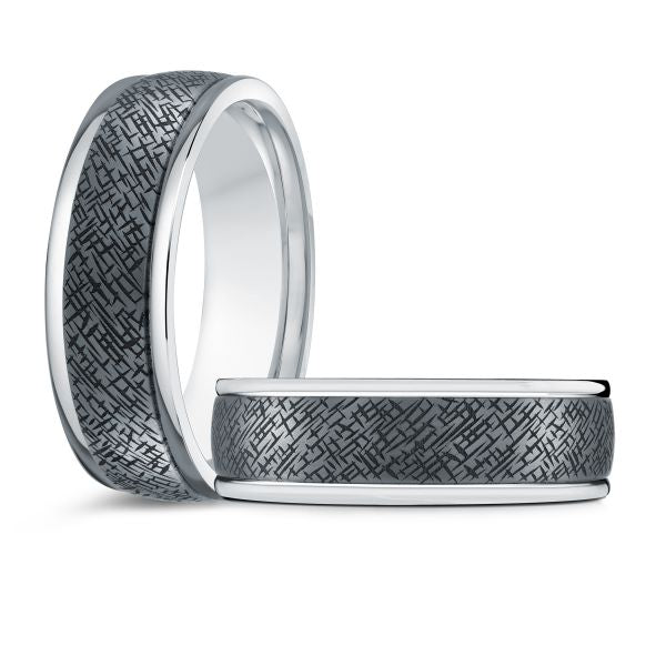 Wedding bands with brushed silver finish and textured black inlay on a white background.