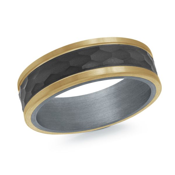 Black ceramic wedding band with a yellow gold inlay on a white background