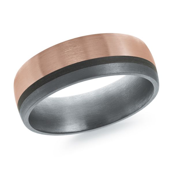 Black ceramic wedding band with a rose gold inlay on a white background