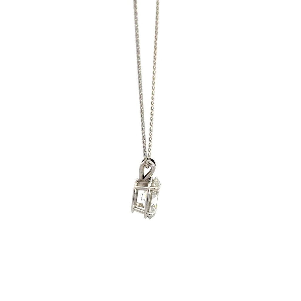 Side view of silver necklace with oval cut diamond pendant