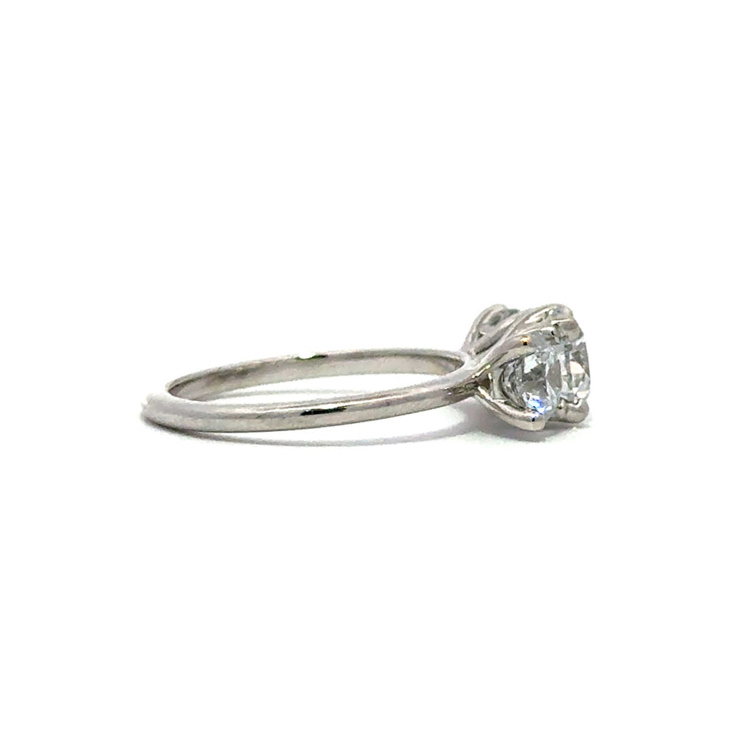 Silver three stone diamond ring in a white background