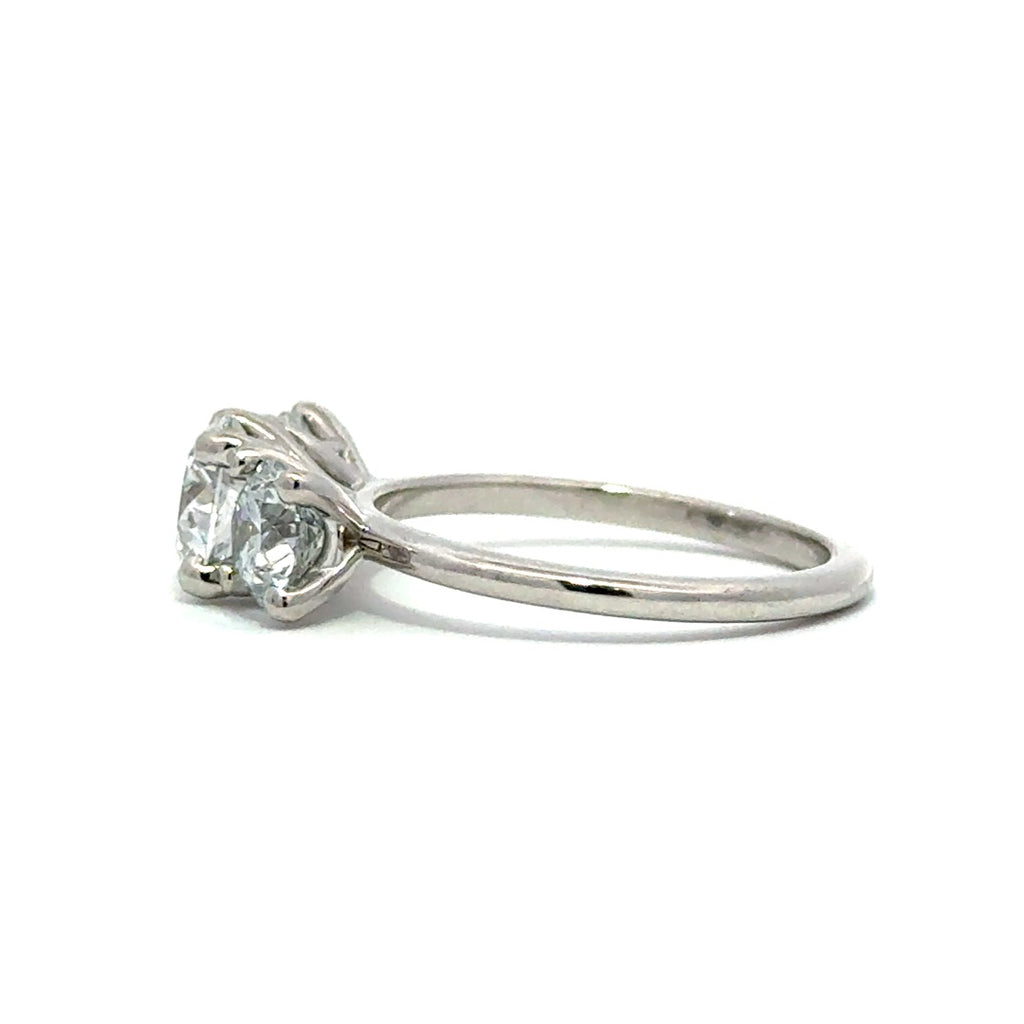 Silver three stone diamond ring in a white background