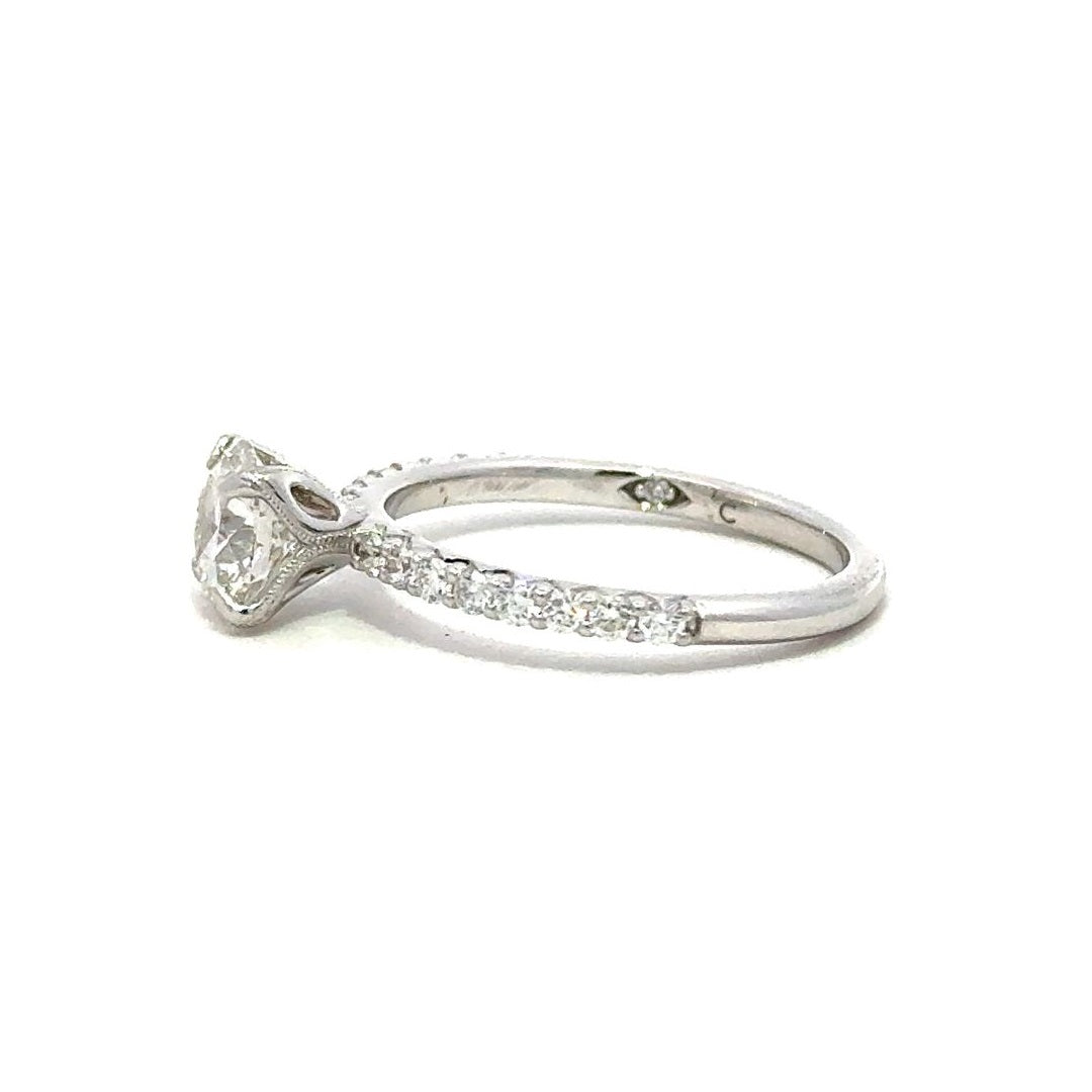 Side view of a engagement ring with a round-cut center diamond.