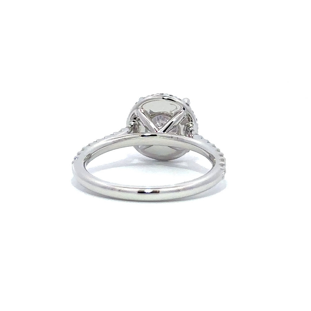 Back view of silver engagement ring with a round-cut center diamond.