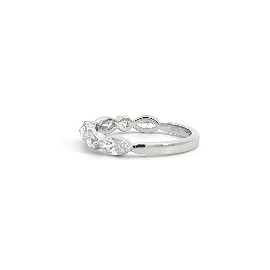 Silver eternity band with alternating round and marquise-shaped diamonds, on a white background.