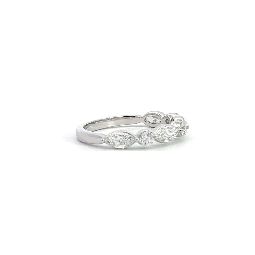 Silver eternity band with alternating round and marquise-shaped diamonds, on a white background.