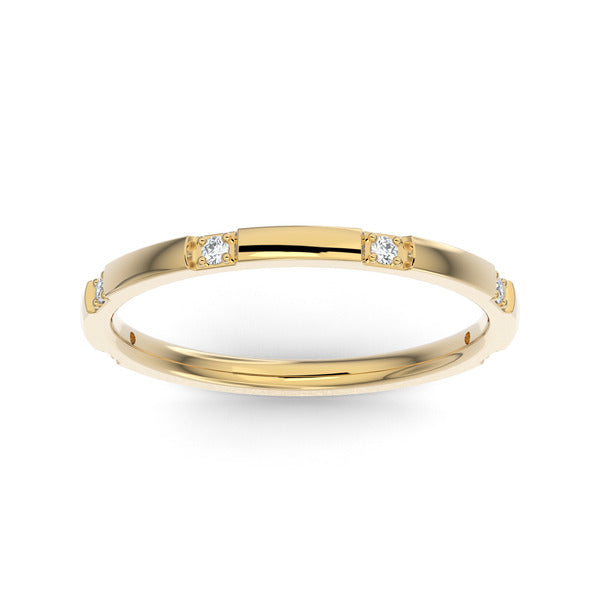 Gold wedding band with diamond accent on a white background.