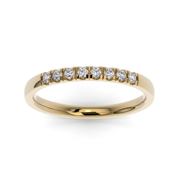 Gold wedding band with diamond accent on a white background.