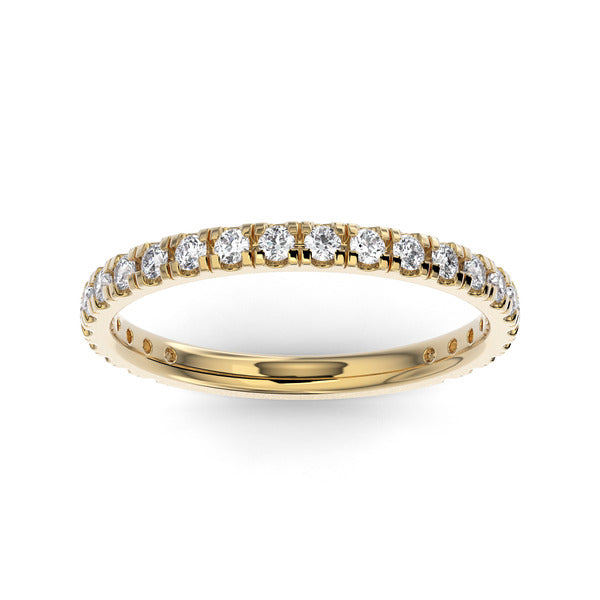 Gold wedding band with diamond accent on a white background.