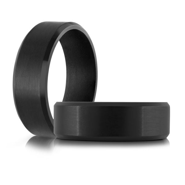 Black carbon fiber wedding band on a white background.