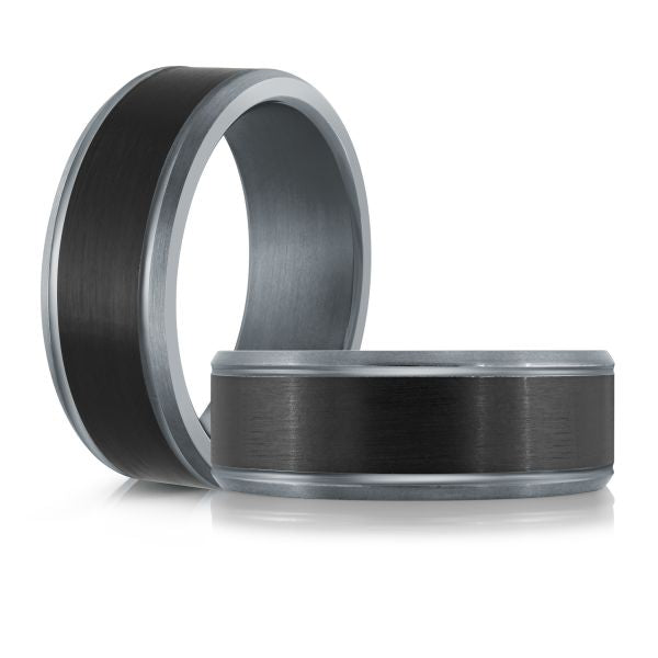 Gray titanium ring with a black carbon fiber inlay on a white background.