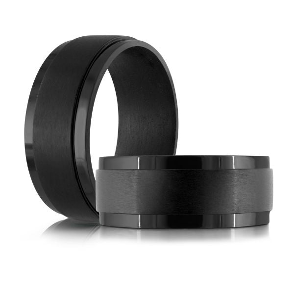 Black carbon fiber wedding band on a white background.