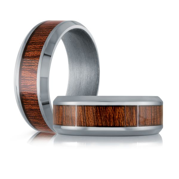 Titanium ring with a wood inlay on a white background.