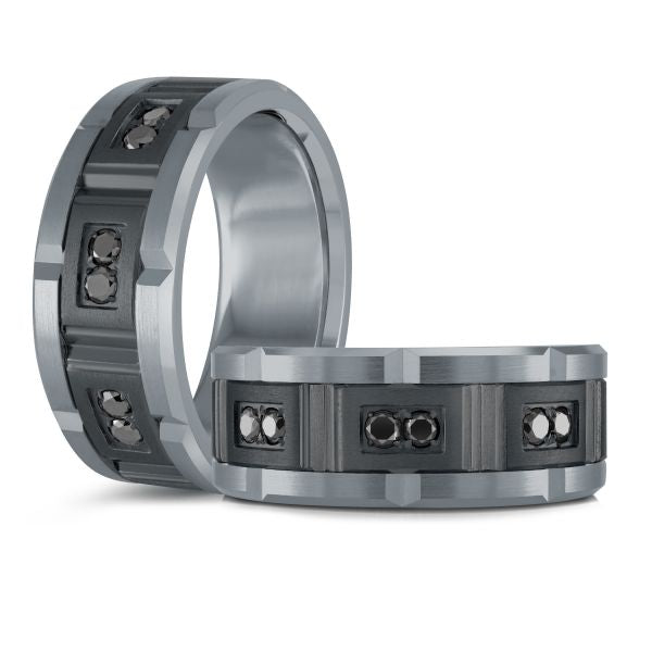 Titanium wedding band with a black carbon fiber inlay and black diamond accents on a white background.