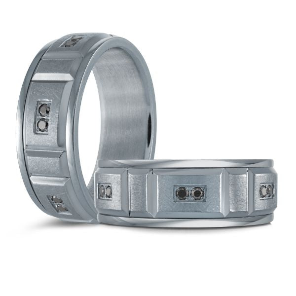 Titanium wedding band with a black carbon fiber inlay and black diamond accents on a white background.