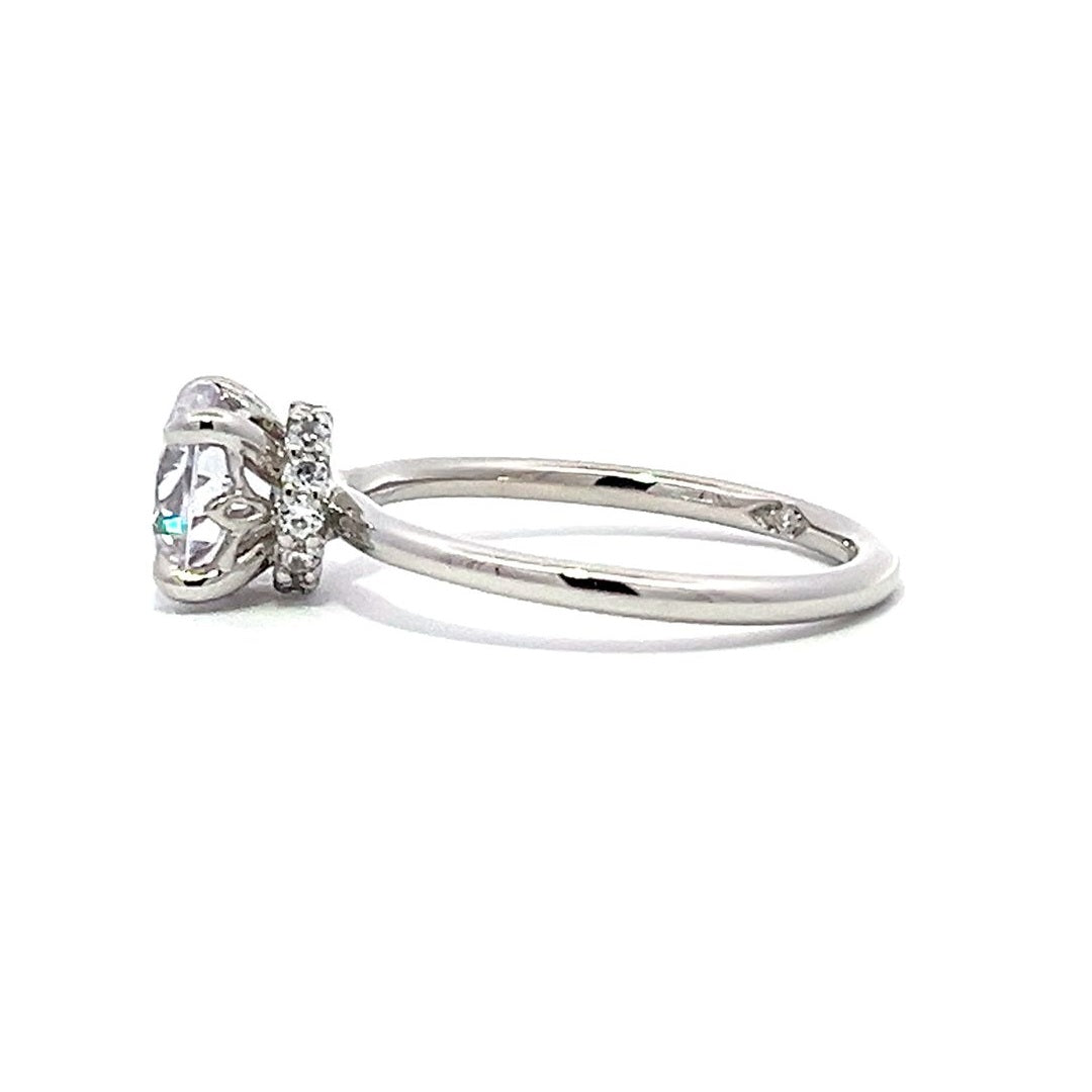 White gold diamond solitaire engagement ring on a white background.