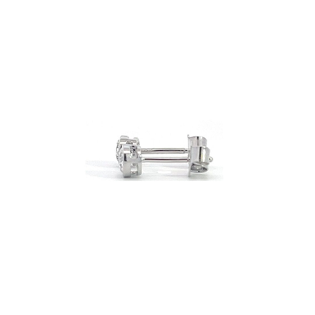 White gold stud earrings with round diamonds in  bezel setting on a white background.