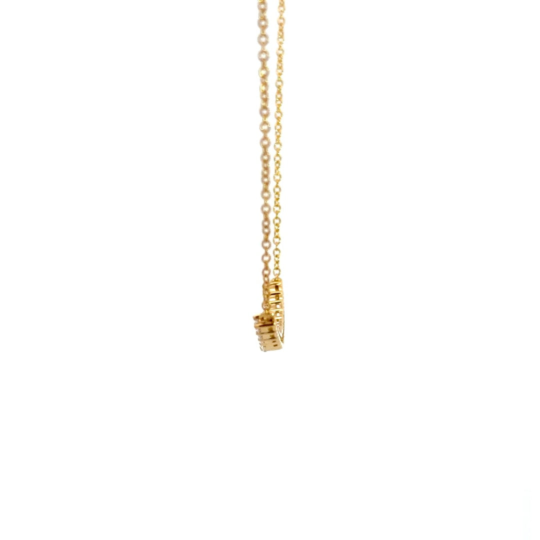 Yellow gold diamond necklace on a white background