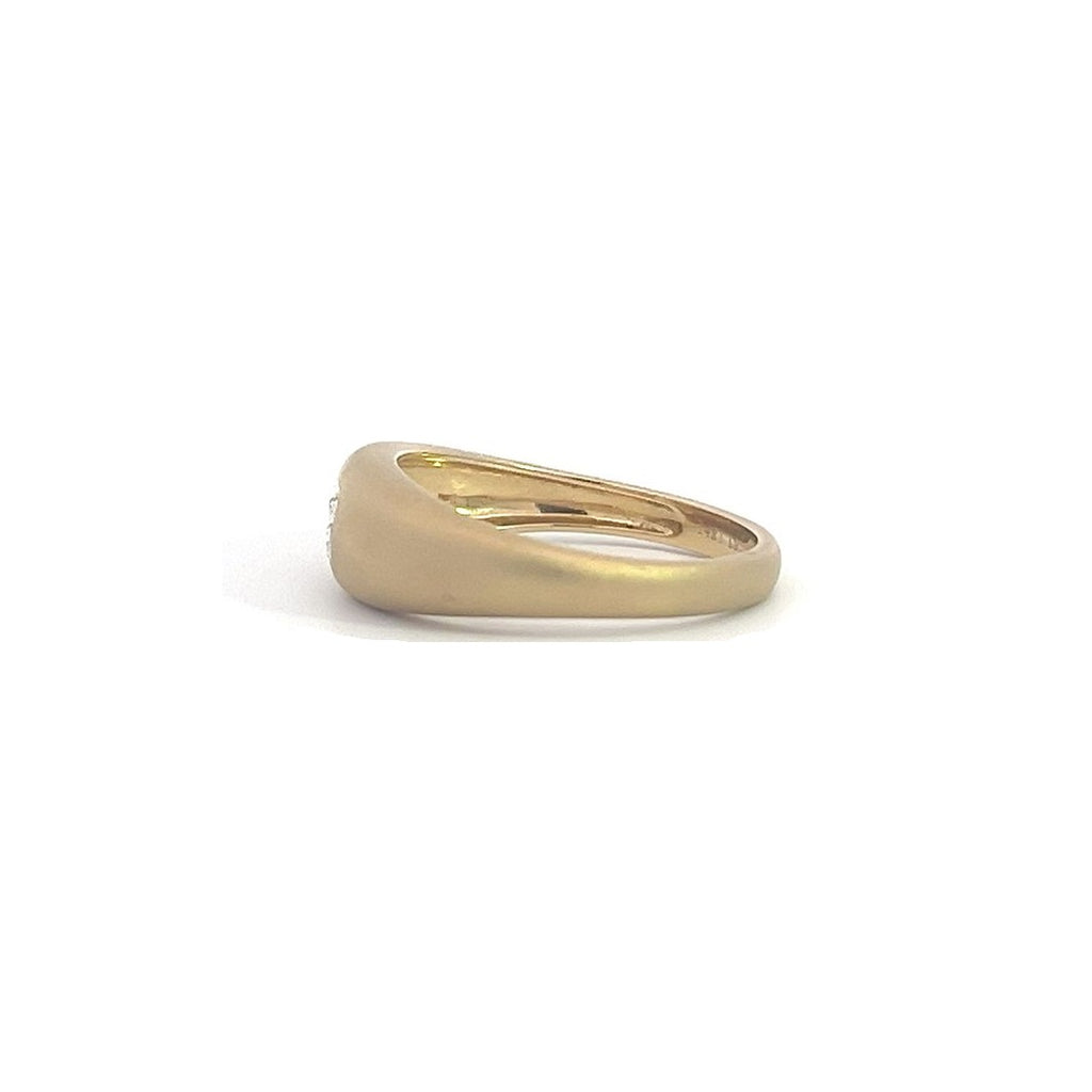 Yellow gold ring with an emerald-cut diamond set in a matte gold band, on a white background.