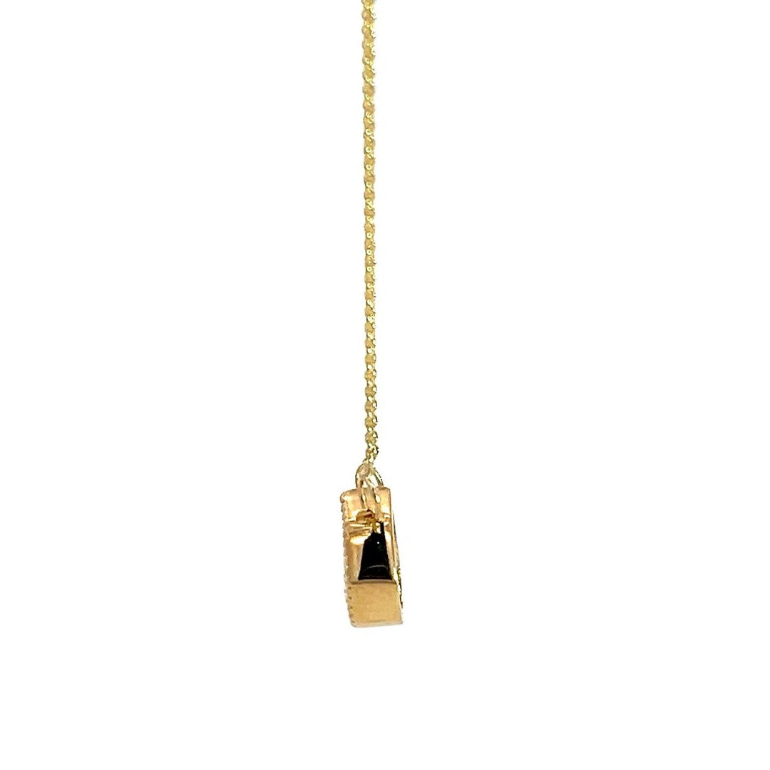  Yellow gold necklace with a pear-shaped diamond pendant on a white background.