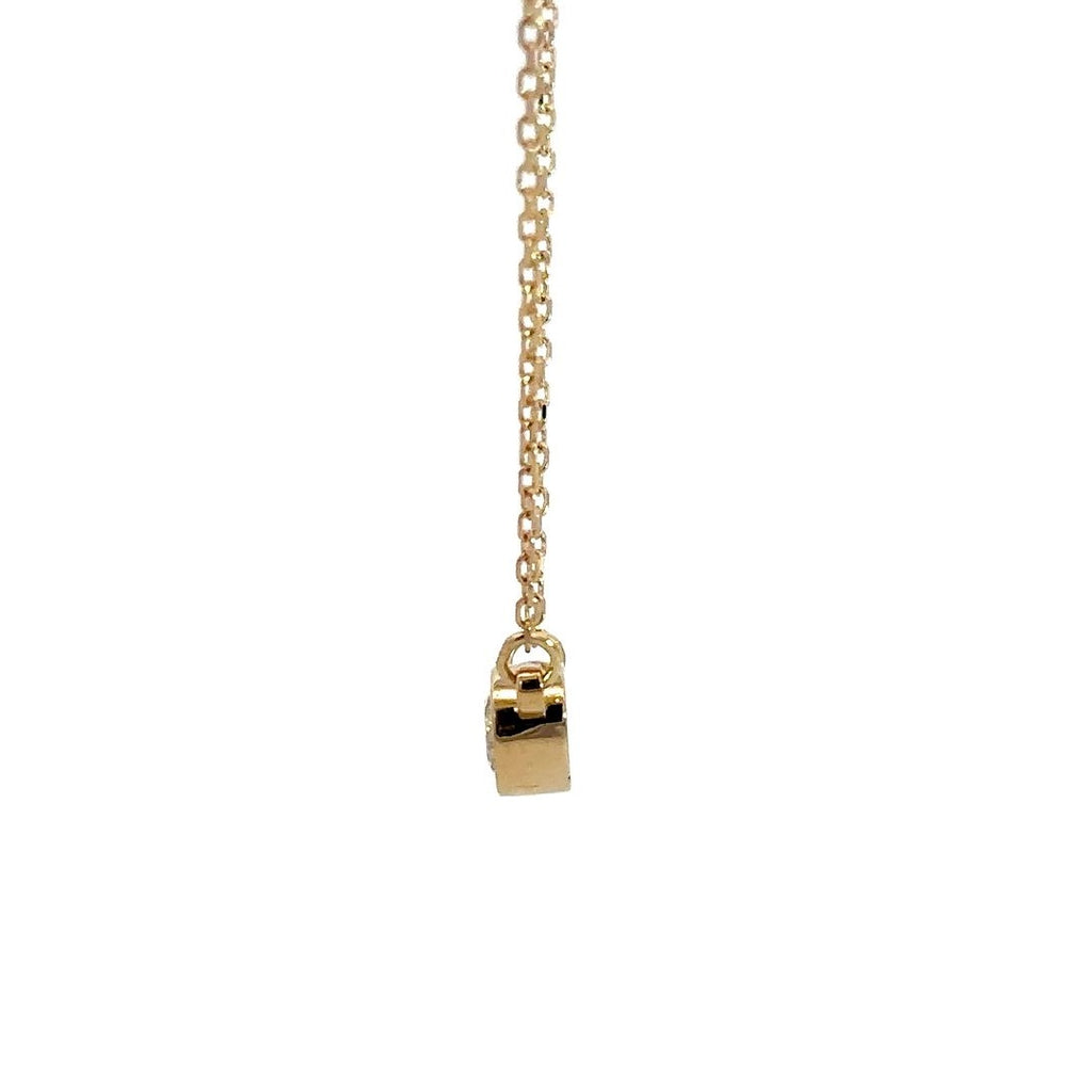 Yellow gold diamond solitaire necklace on a white background