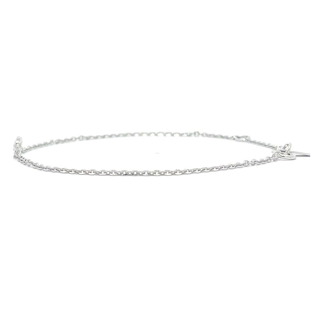 Silver bracelet with a single diamond pendant on a white background.