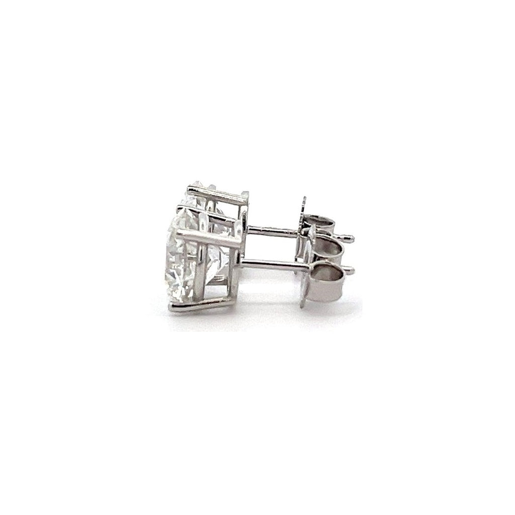 White gold stud earrings with round diamonds on a white background.