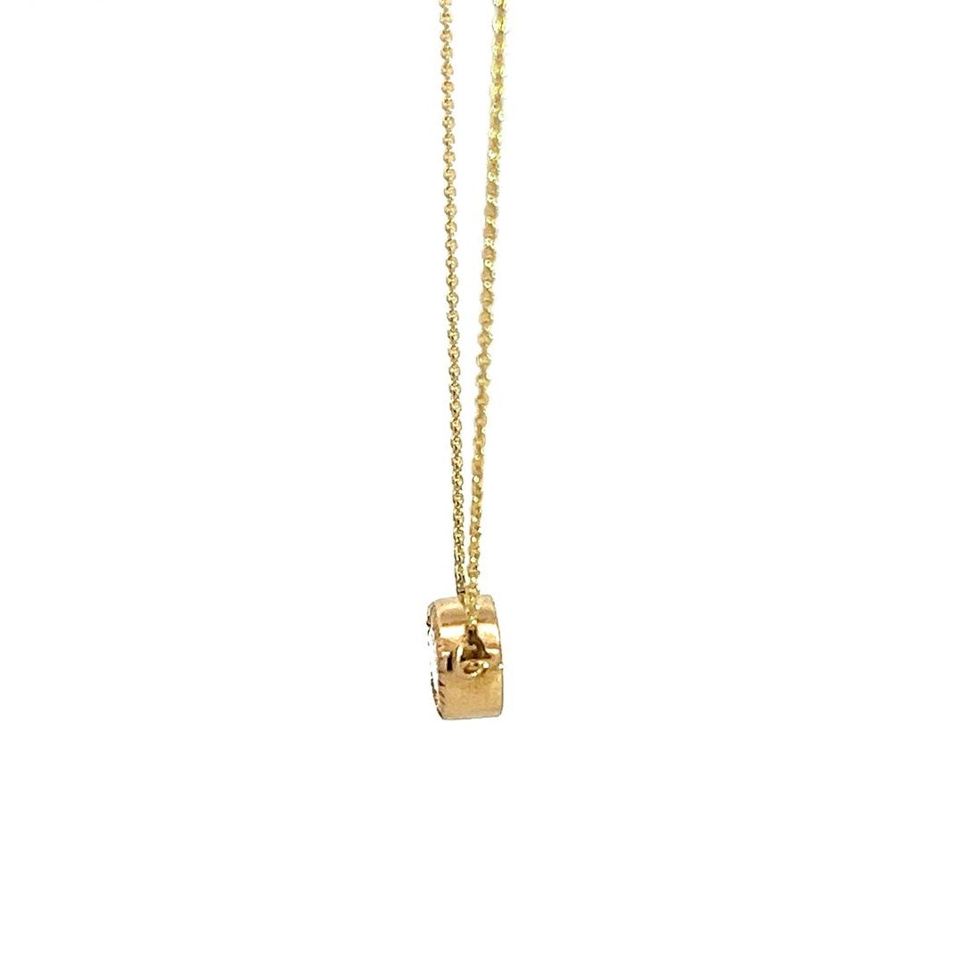 Yellow gold necklace with an emerald-cut diamond pendant on a white background.