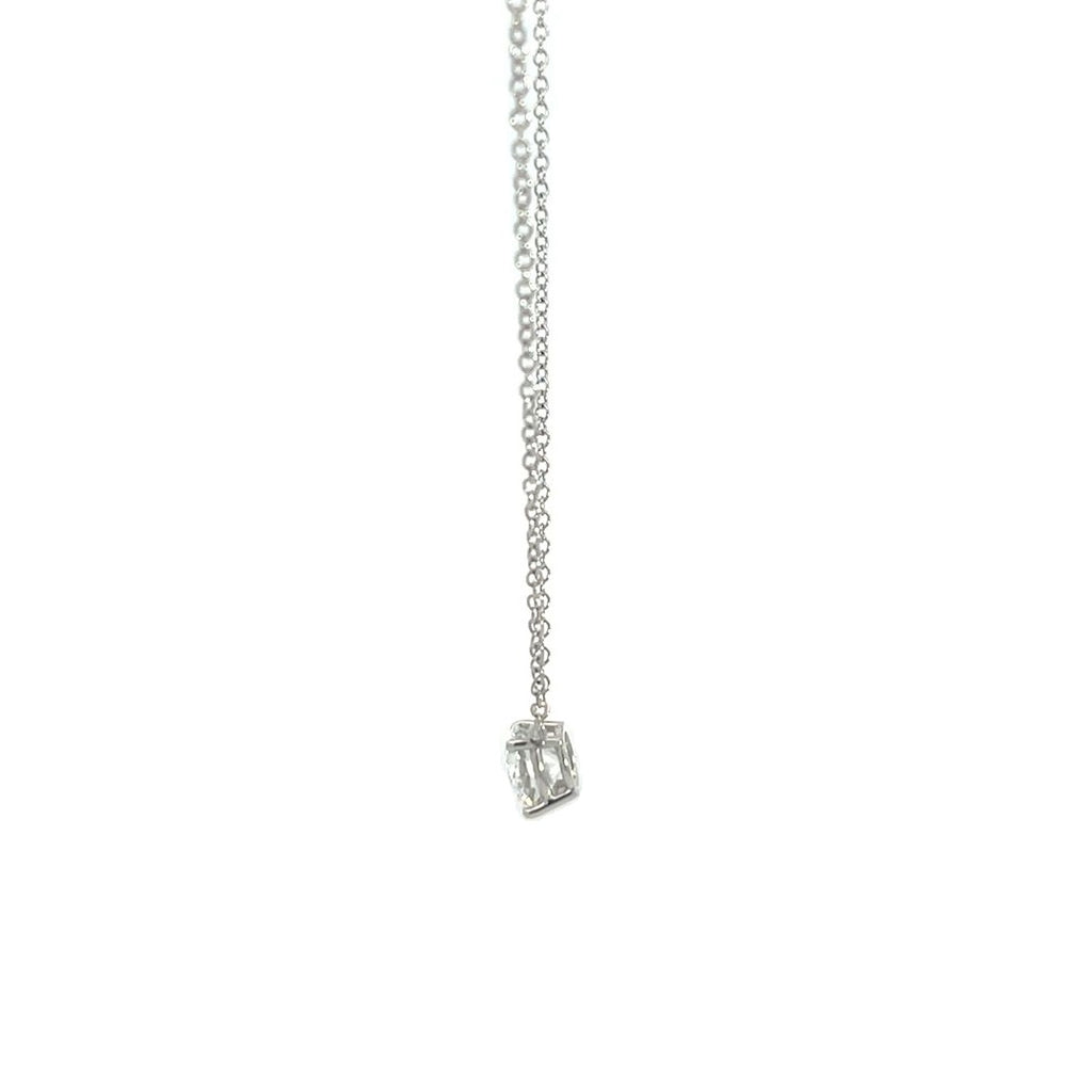 Silver necklace with a round diamond solitaire pendant on a white background.