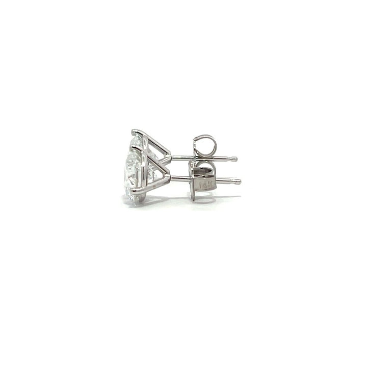 White gold stud earrings with round diamonds on a white background.