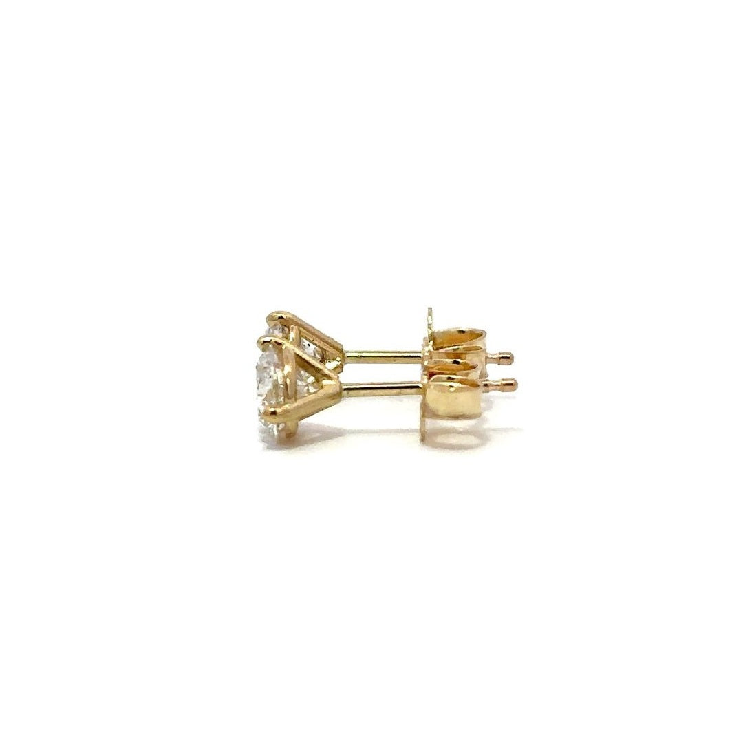 Yellow gold diamond stud earrings on a white background