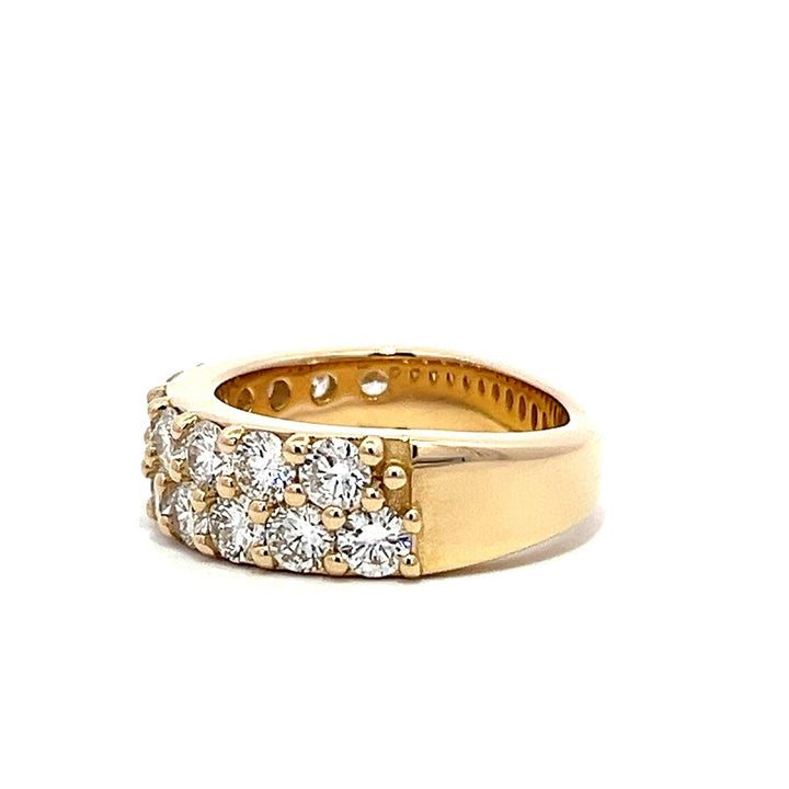 Yellow gold eternity band with two rows of pave-set diamonds on a white background.